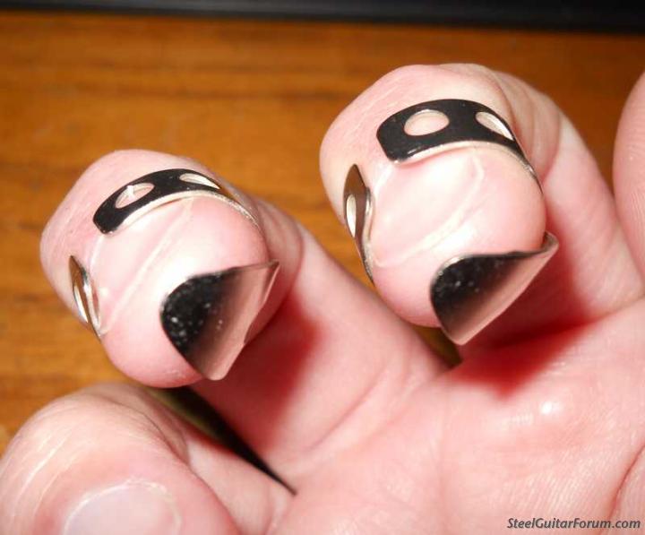 steel finger picks worn on two fingers